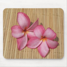 Pink plumeria blossoms on bamboo background mouse pads