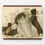 Playful daschunds with holly berry and vase mousemat
