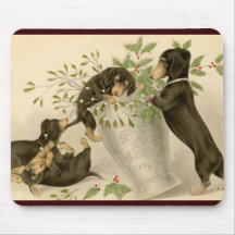 Playful daschunds with holly berry and vase mousemat