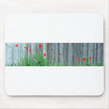 Poppies on a wall mousepads