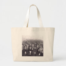 Praying by candle light in Lourdes, France Canvas Bags