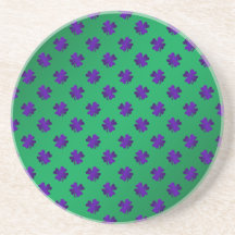 Purple shamrocks on green background coasters