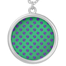 Purple shamrocks on green background pendants