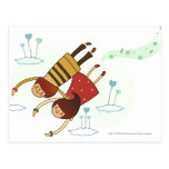 Rear view of a couple flying together postcards