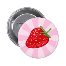 Red ripe strawberry on pink sunburst button or pin