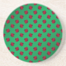 Red shamrocks on green background drink coasters