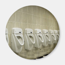 restroom interior with urinal row refrigerator magnets