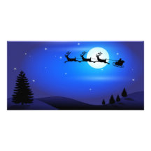 Santa and Reindeer Flying Across Blue Night Sky Customized Photo Card