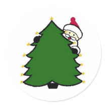 Santa Hides Behind Christmas Tree
