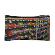 Shelves of chocolate bars in store makeup bags