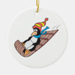 silly sledding penguin christmas ornaments