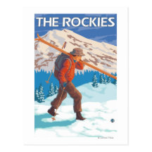 Skier Carrying Snow Skis - The Rockies Postcard