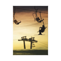 Skiing at sunset canvas prints
