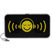 Smiley with headphones listening on music speakers