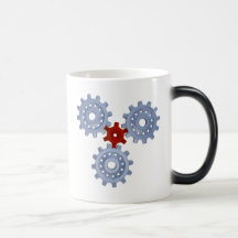 Some silver gears with a little red mug