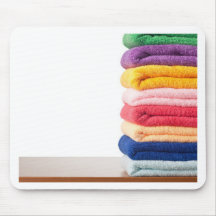 Stack of colourful microfiber towels mousemat