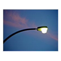 Street light against a sunset cloud post cards