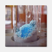 Test tube with blue chemical powder magnets