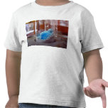 Test tube with blue chemical powder shirt