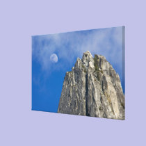 The moon rises and shines through the clouds canvas prints