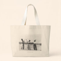 Three men lassoing. bags