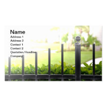 top of an outdoor black iron fence business cards