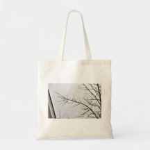 Tree Branch without leaves against cloudy sky Tote Bag