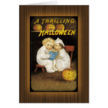 Two children reading ghost stories card