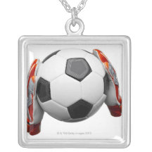 Two goal keepers gloves holding a football jewelry