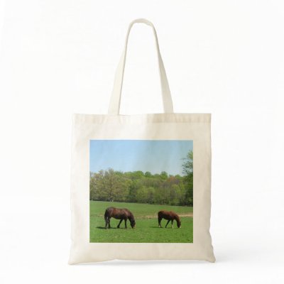 Two horses in field with trees and pond tote bags by catsphotography