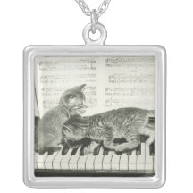 Two kitten playing on piano keyboard, (B&W) Jewelry