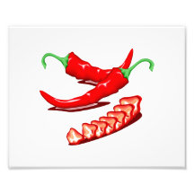 Two red chilli peppers one cut up also photograph