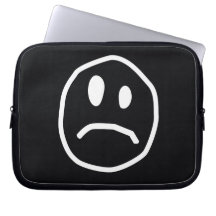 Unhappy face laptop sleeve