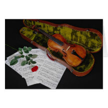 Violin and red rose on black background greeting card