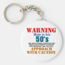 Warning male in his 50's keychains