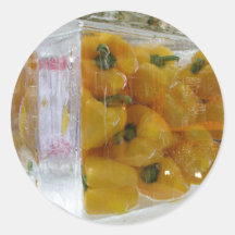 Yellow peppers in ice round sticker