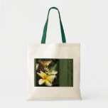 Yellow tropical plumeria flower tote bags
