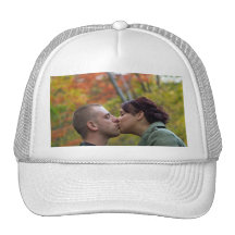 Young Couple Kissing Hat