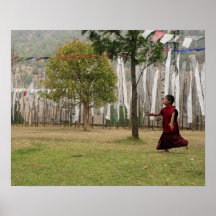 Young monk and prayer flags posters