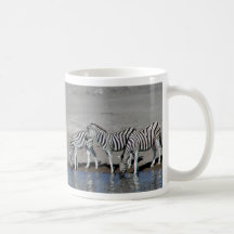 Zebras and giraffe at the local watering hole Mug