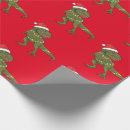 Search for xmas dinosaur wrapping paper Santa