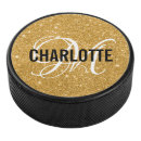 Search for gold hockey pucks Sports