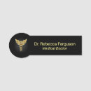 Search for black and gold name tags Caduceus