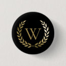 Search for ornate initial badges For him