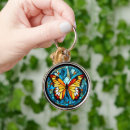 Search for gold border key rings Butterfly