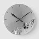 Search for black and white cat clocks Paws