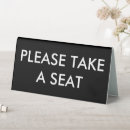 Search for take a seat signs Reception