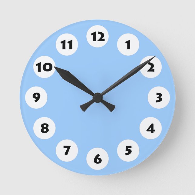 12 Spots - Black with White on Pale Blue Round Clock (Front)