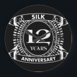 12TH wedding anniversary silk Large Clock<br><div class="desc">Your twelfth wedding anniversary has the traditional gift is silk. This crest style design is a romantic design for couples celebrating 12 years of marriage. If you would like any help customising this design please contact me,  their is an ask this designer button,  just below this text.</div>