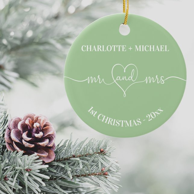 1st Christmas newlyweds names heart sage green Ceramic Ornament (Creator Uploaded)